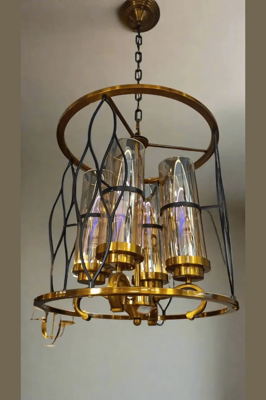 Luxury Gold and Glass Chandelier with Intricate Black Metal Design