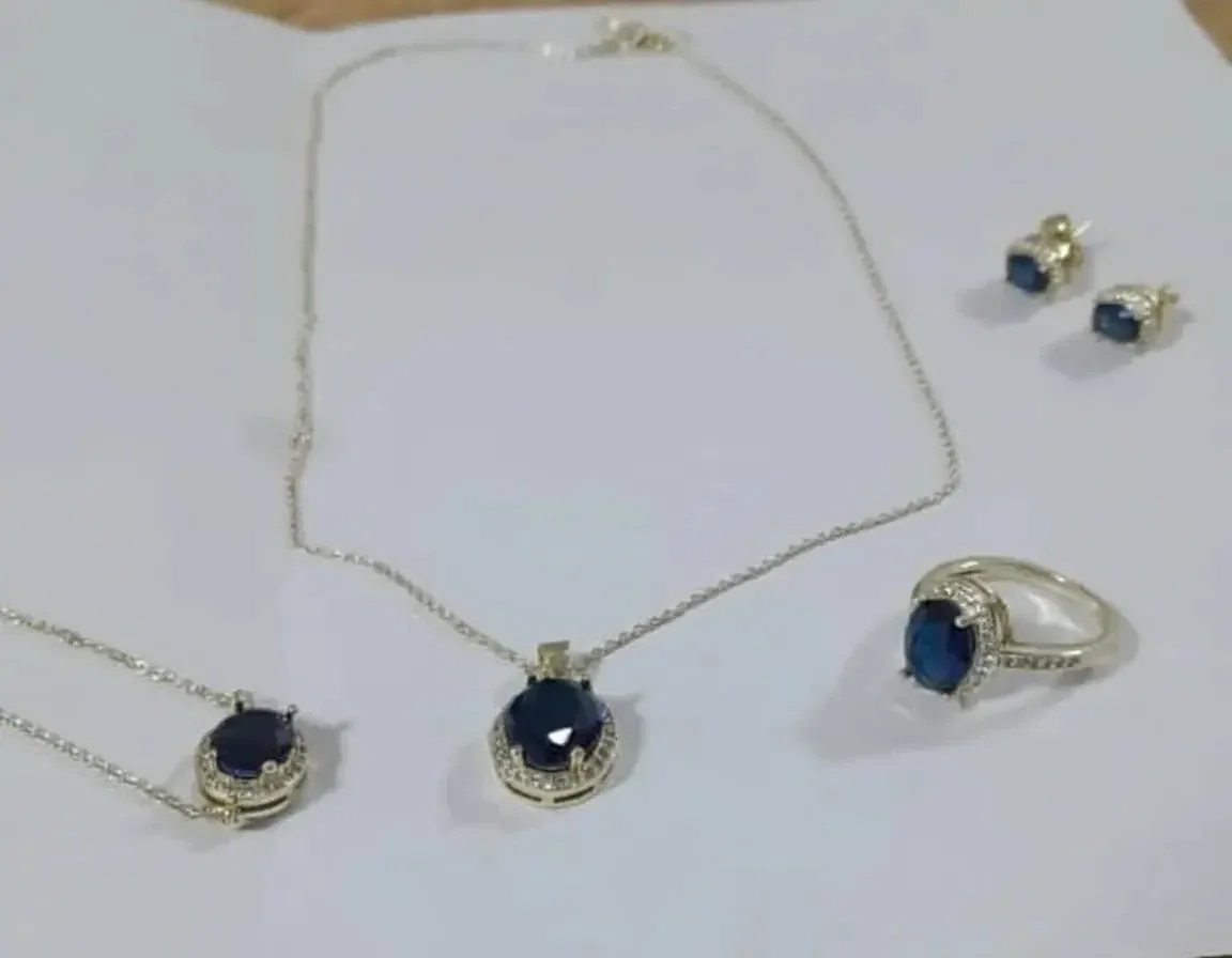 4-piece jewelry set features a striking dark blue stone