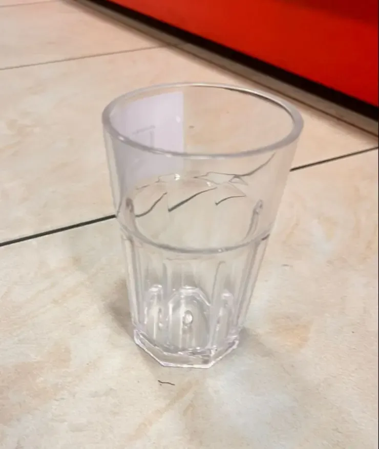 Unbreakable Plastic Water Tumbler on Tiled Floor 130ml 1pcs